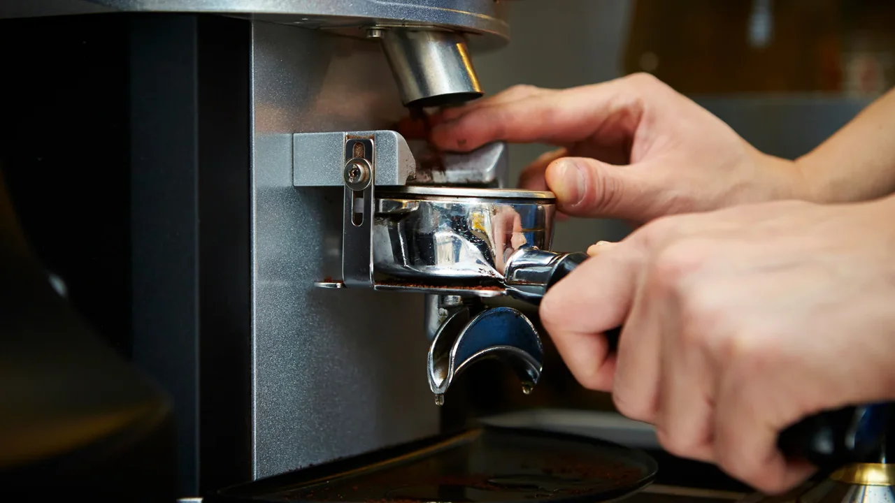Close up on a plate of mashed potatoes, topped with baked pork chops with cream of mushroom soup, and a side of green beans.
