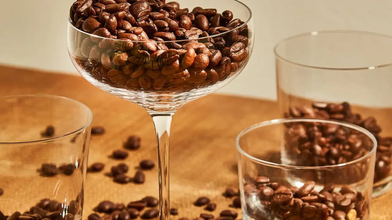 Close up on a plate of mashed potatoes, topped with baked pork chops with cream of mushroom soup, and a side of green beans.