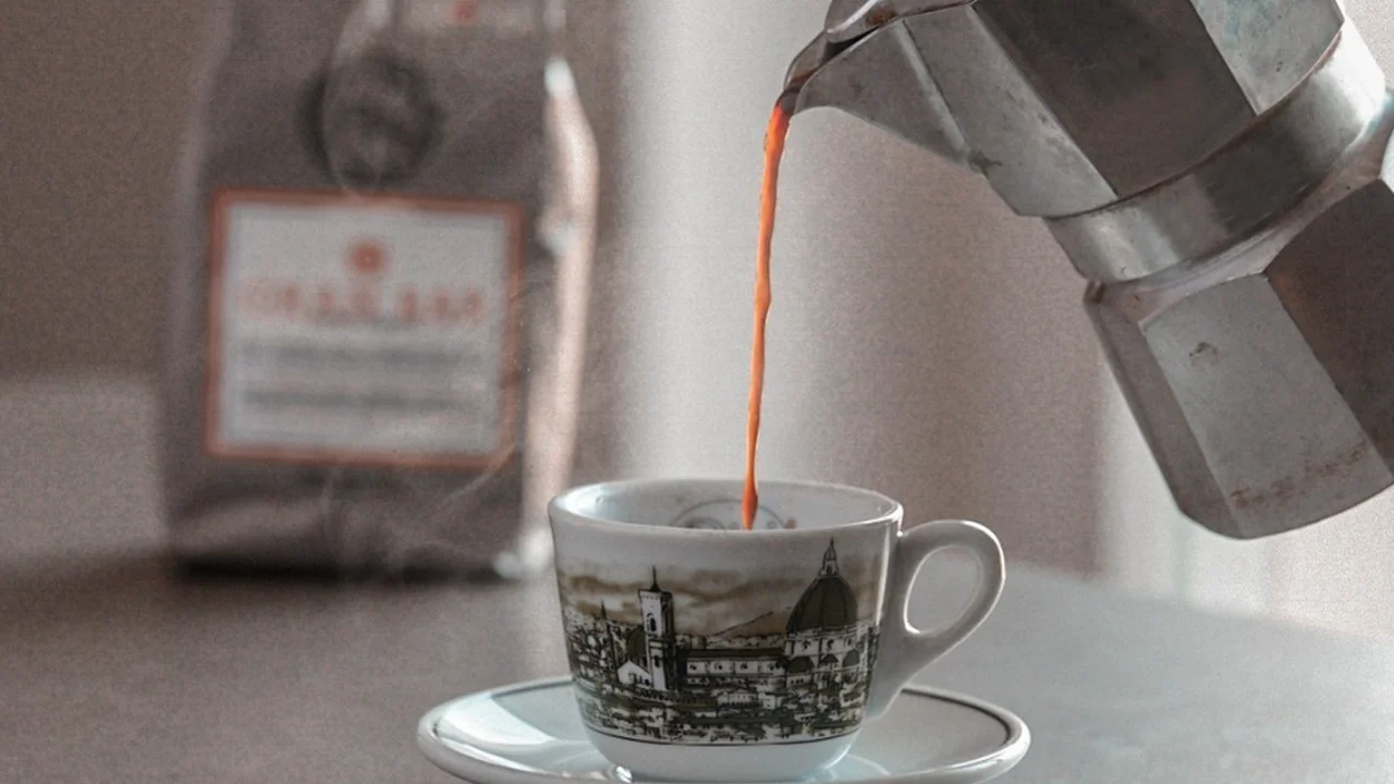 Close up on a plate of mashed potatoes, topped with baked pork chops with cream of mushroom soup, and a side of green beans.